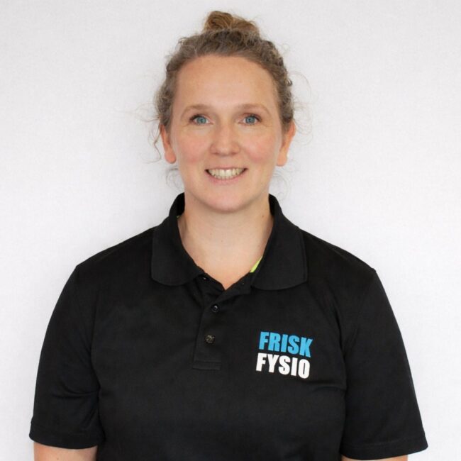 Staff physiotherapist Tatiana at Frisk Physio Tatiana, physiotherapist at Frisk Physio, smiling in black uniform with logo, professional attitude, healthy look.