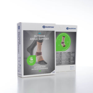 Outdoor enkelbandenvoetondersteuning productverpakking met ankergreep en grafische elementen in groen en wit, gericht op sport en buitenactiviteiten.
