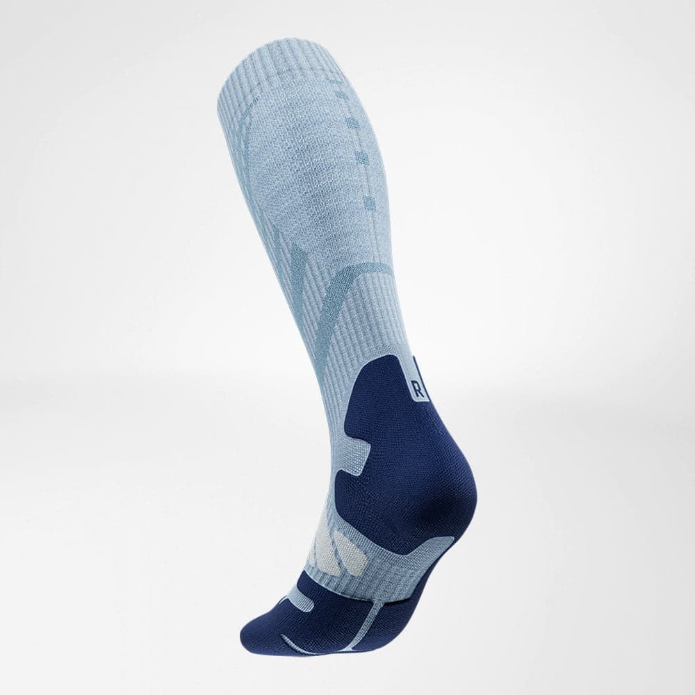 Outdoor Merino Compression Socks 3 Three-piece sports sock with a light blue upper and dark blue heel and toes, designed to provide support and breathable comfort during physiotherapy exercises.