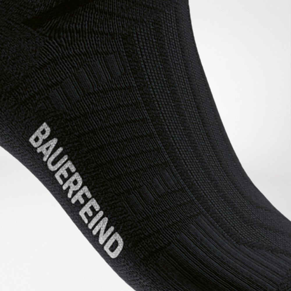 Run Performance Low-Cut Socks 8 A three-quarter view of a pair of BAUERFEND sports socks in black, with a contoured texture and structure for maximum support during training.