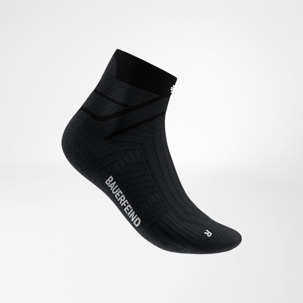 Run Performance Low-Cut Socks 1 Bauerfeind cotton socks in a sporty design for foot-to-ankle support; black compression socks with the Bauerfeind logo at the bottom.