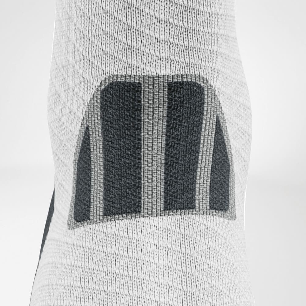 Trail Run Mid-Cut Socks 6 Support your lower leg with a FriskFysio sports knee brace, white with a black collar and a breathable weave, designed to provide knee support and prevent injuries.