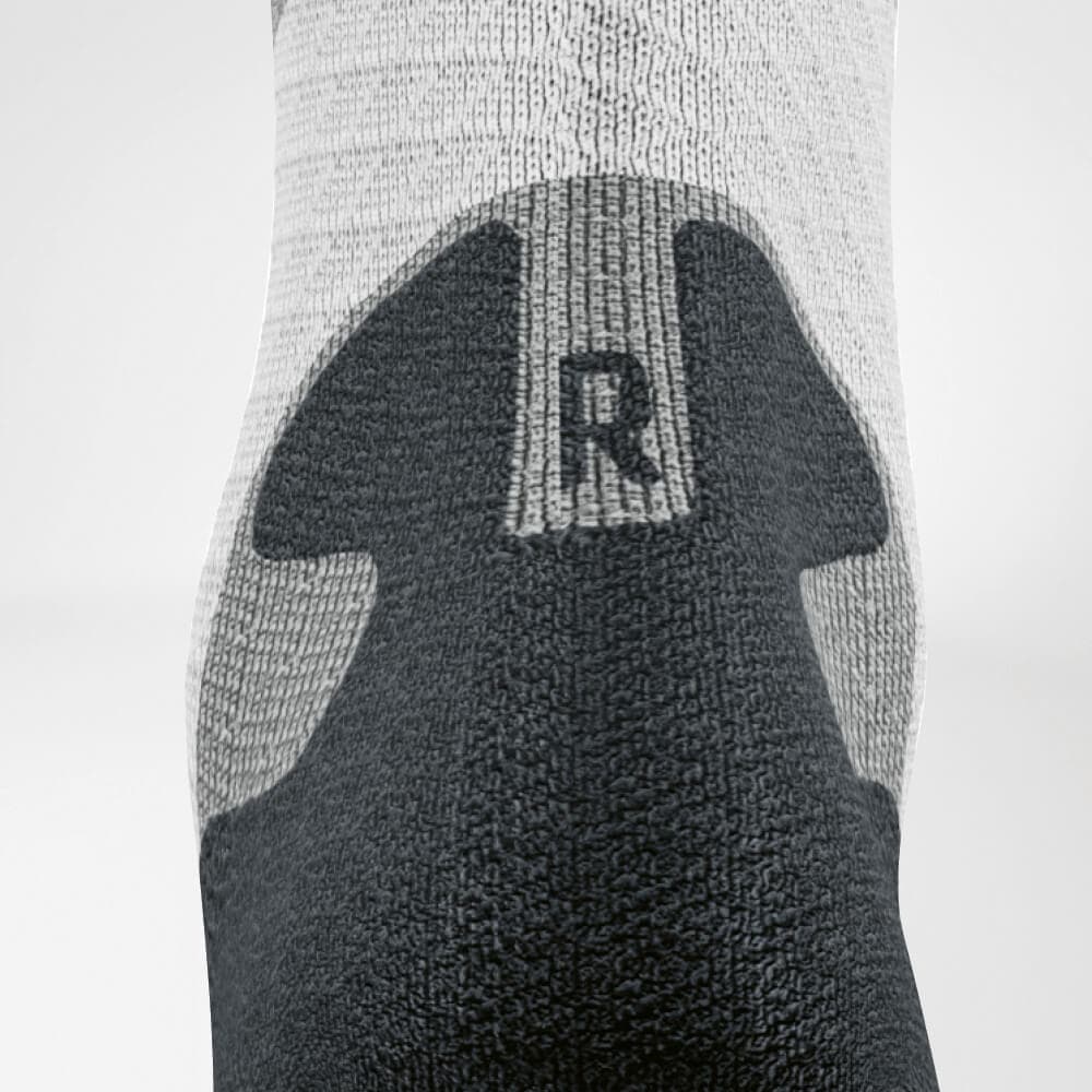 Trail Run Mid-Cut Socks 7 Friskfysio socks for foot care, with a visible heel tab and an ‘R’ label on the sole; a sportswear brand.